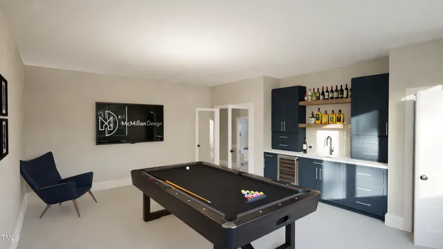 a living room with furniture pool table and lamp
