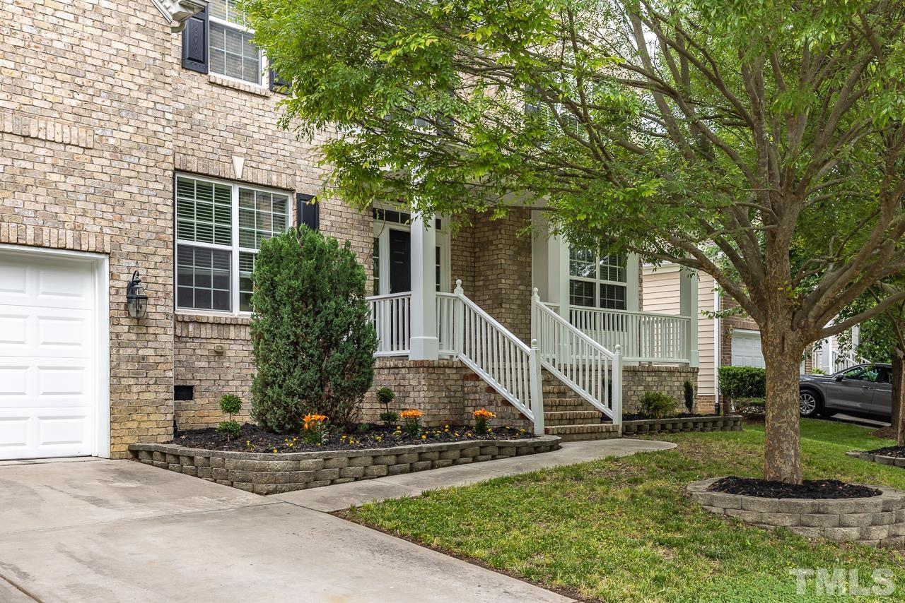 4506 Paces Ferry Drive Durham, NC 27712 - Photo 2 of 38 a front view of a house with a yard