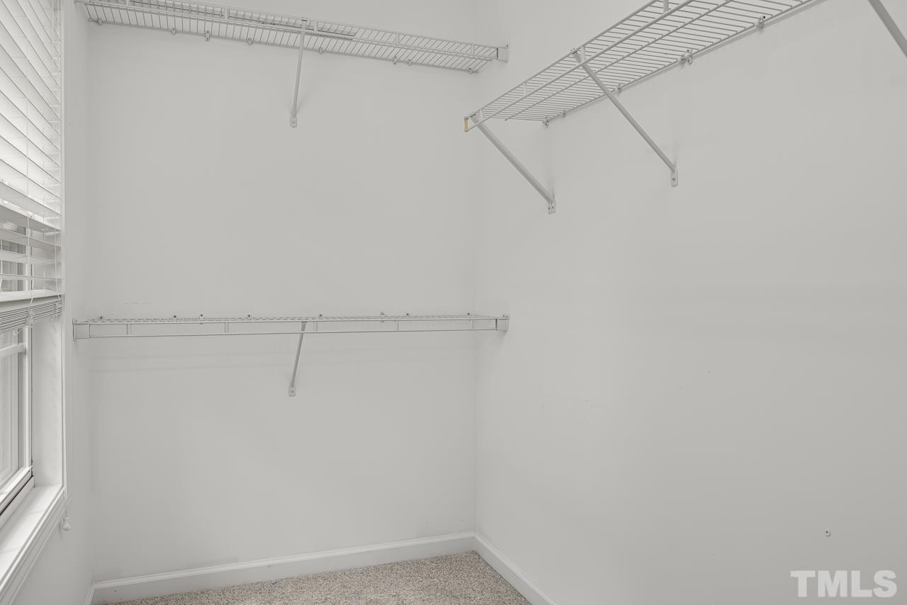4506 Paces Ferry Drive Durham, NC 27712 - Photo 24 of 38 a view of a room with racks on the wall