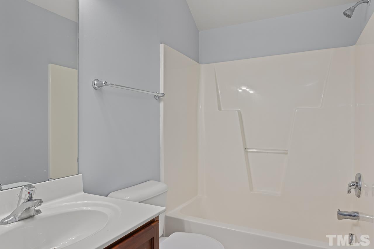 4506 Paces Ferry Drive Durham, NC 27712 - Photo 29 of 38 a bathroom with a sink and a mirror