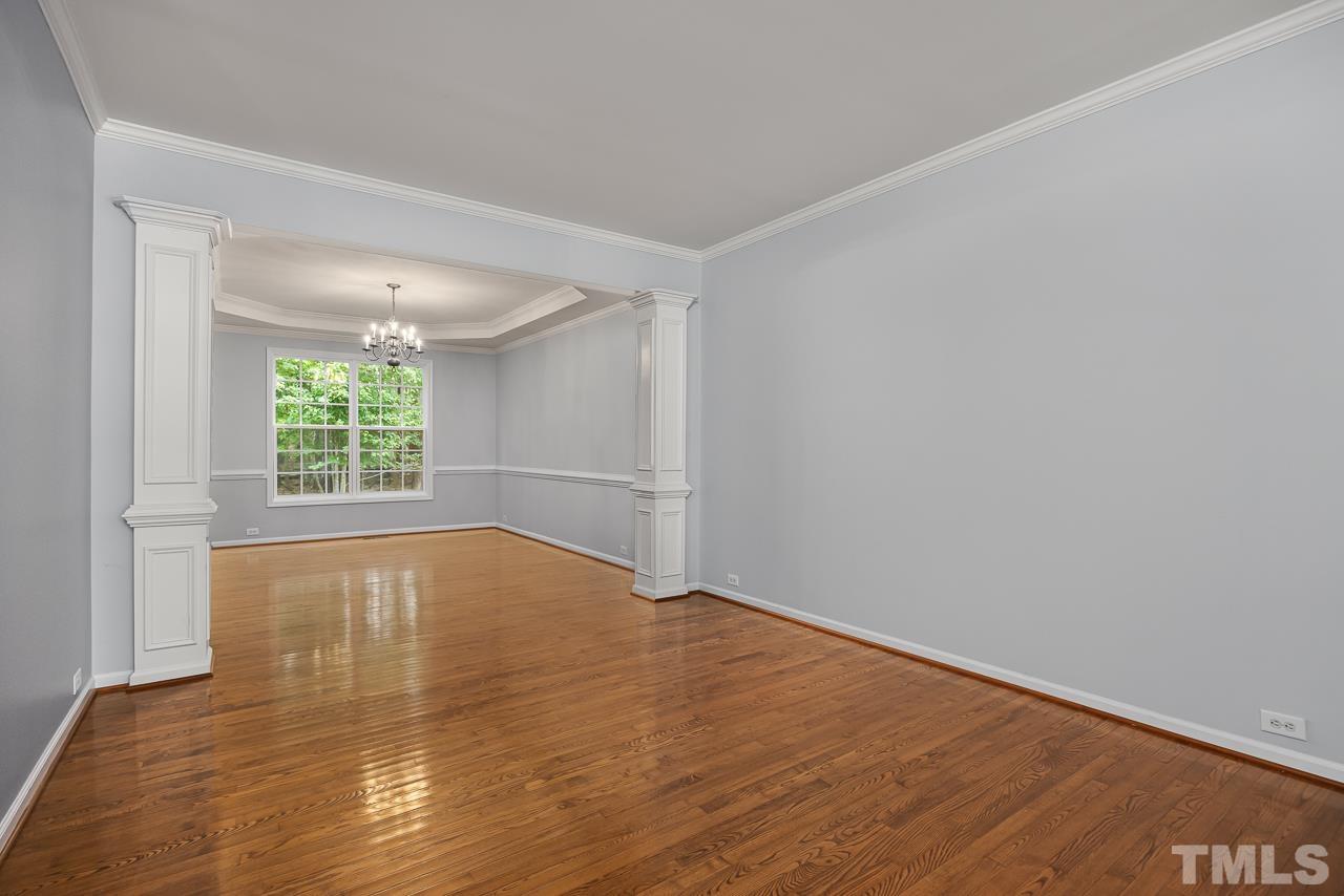 4506 Paces Ferry Drive Durham, NC 27712 - Photo 8 of 38 a view of empty room with wooden floor and fan