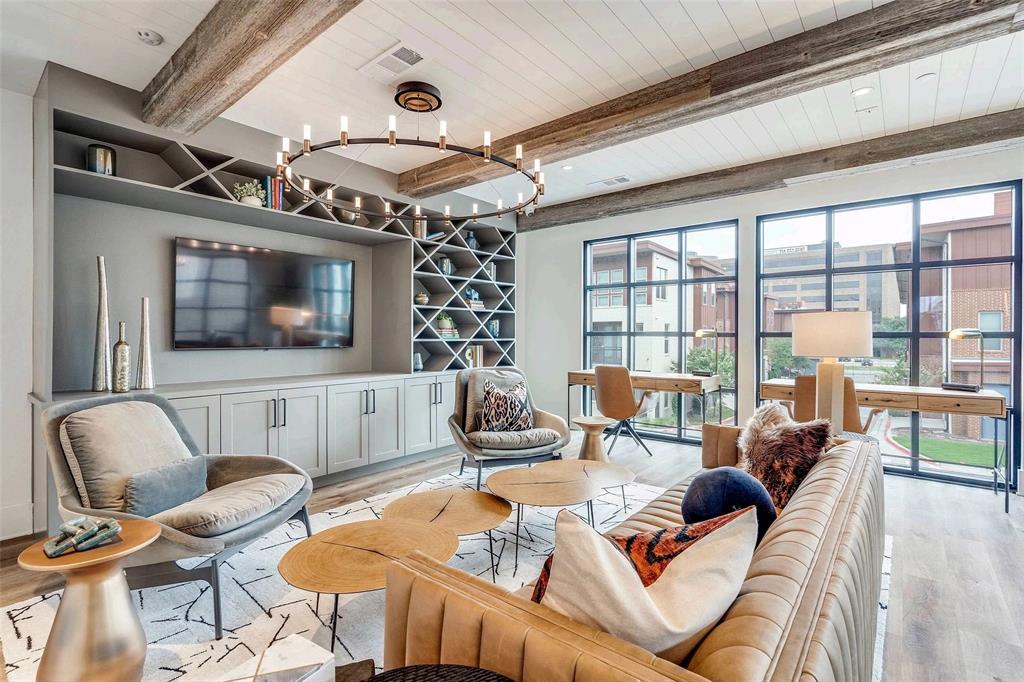 4020 McEwen Road, Unit 9123 Farmers Branch, TX 75244 - Photo 16 of 20 Living room with wood finished floors and a wooden ceiling with exposed beams