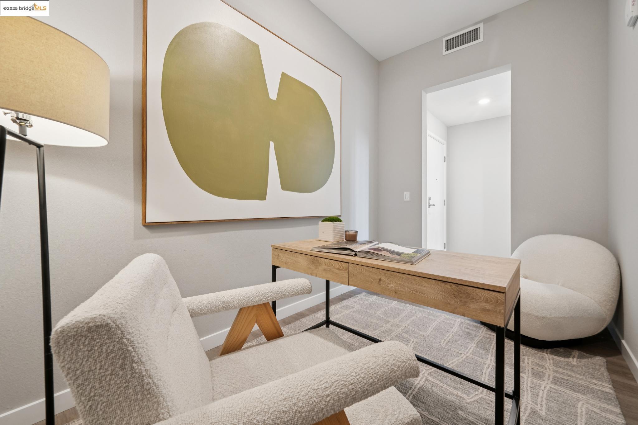 2400 Adeline Street, Unit 403 Oakland, CA 94607 - Photo 21 of 25 a living room with furniture and a mirror