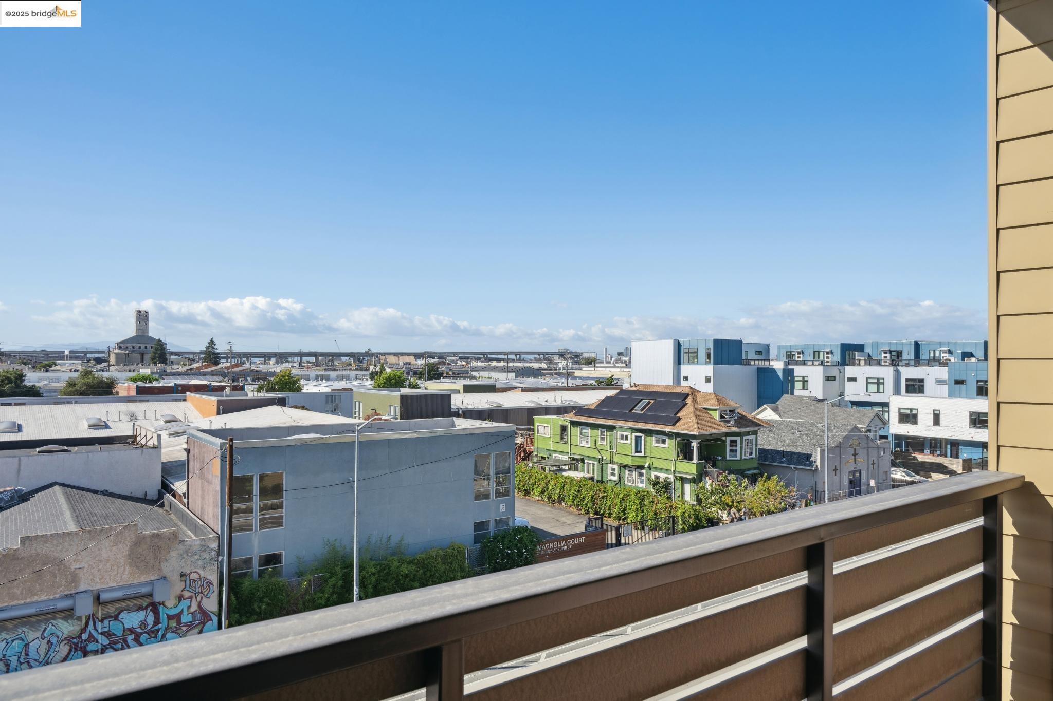 2400 Adeline Street, Unit 403 Oakland, CA 94607 - Photo 23 of 25 a view of a balcony with an outdoor seating