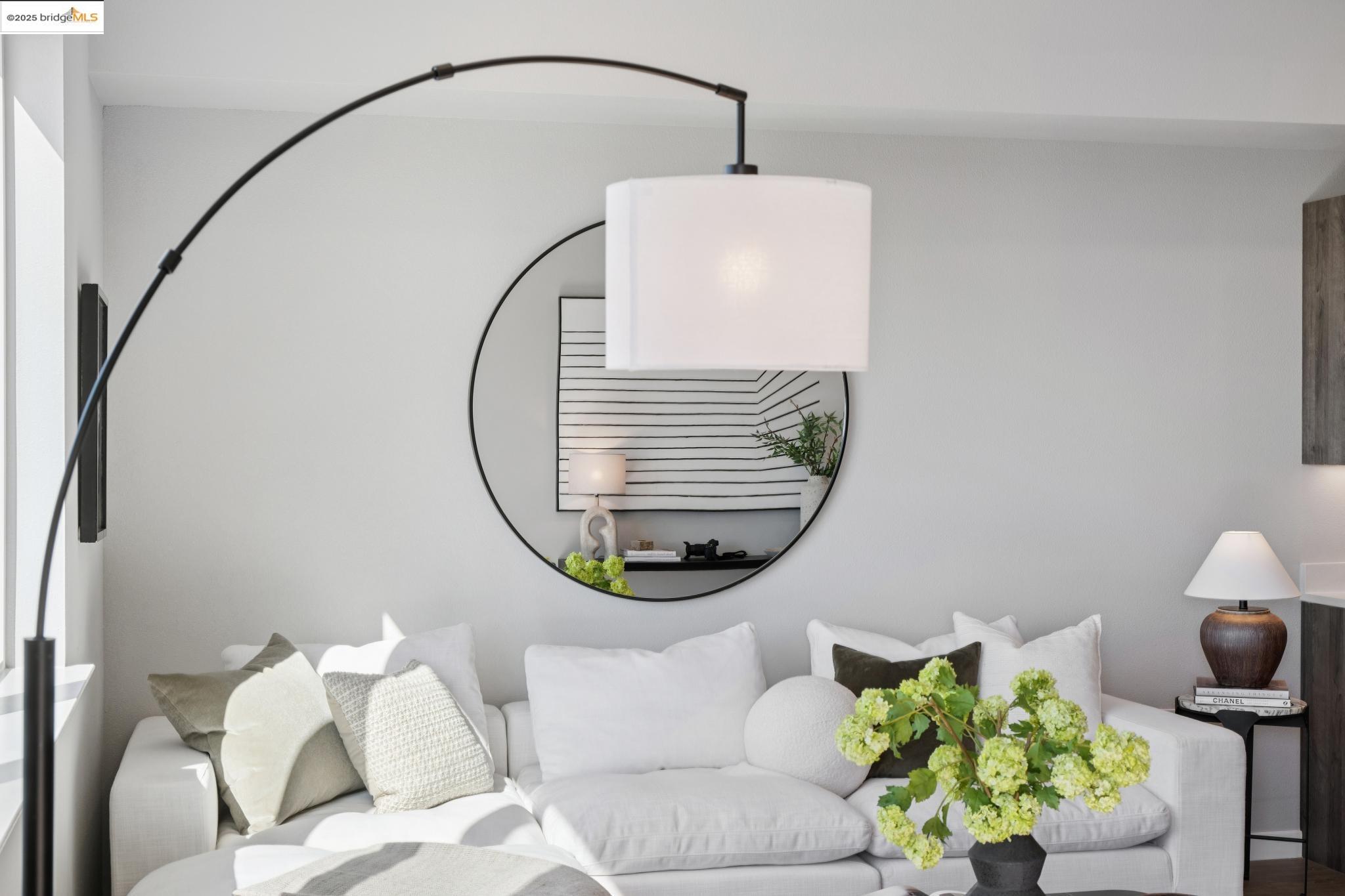 2400 Adeline Street, Unit 403 Oakland, CA 94607 - Photo 5 of 25 a living room with furniture and a mirror