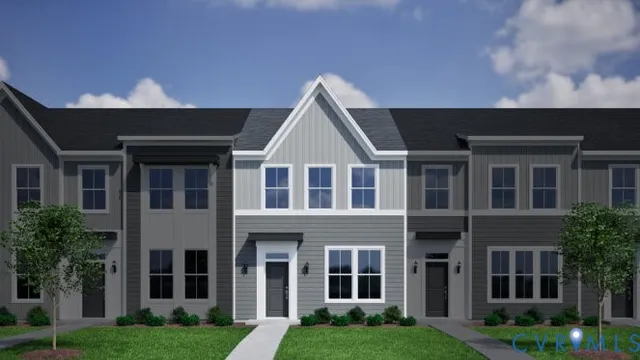 a view of house with yard and front view of a house