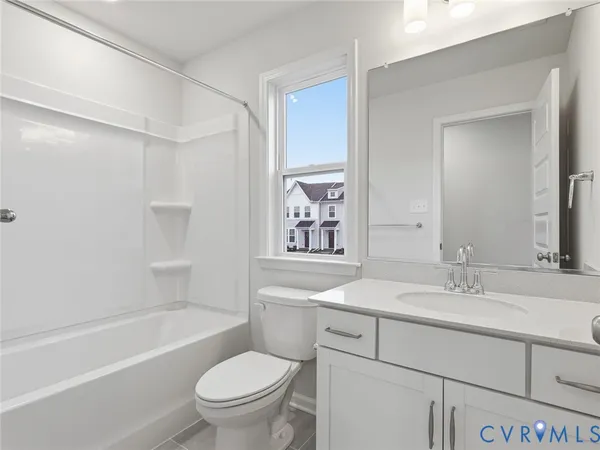 a bathroom with a sink a toilet and a bathtub