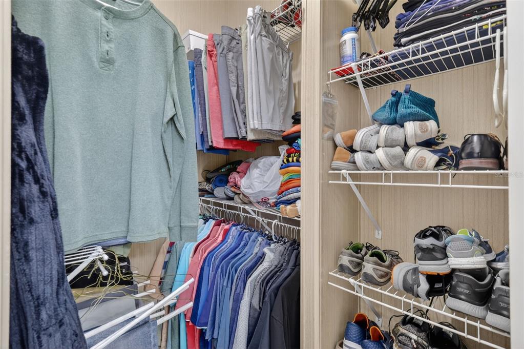 3567 Manatee Road Tavares, FL 32778 - Photo 22 of 45 a view of walk in closet with clothes and shoes