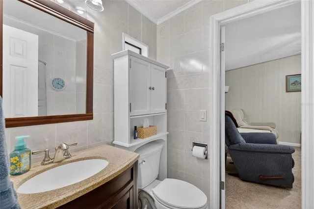 a bathroom with a sink toilet tub and shower