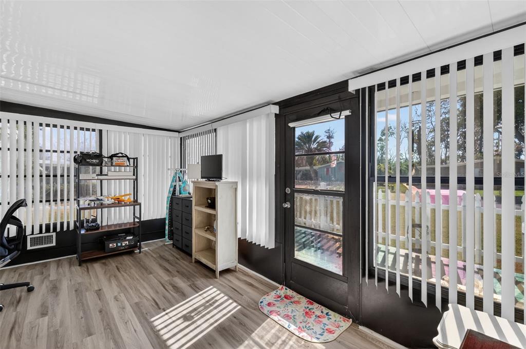 3567 Manatee Road Tavares, FL 32778 - Photo 24 of 67 a view of a bedroom with furniture and window