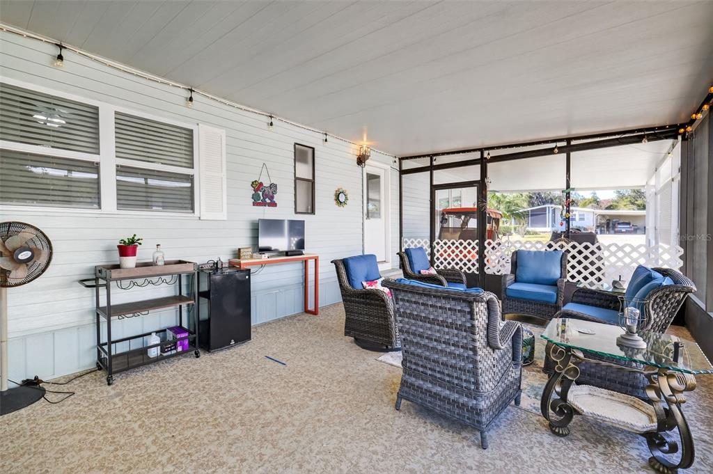 3567 Manatee Road Tavares, FL 32778 - Photo 25 of 67 a living room with furniture and a window