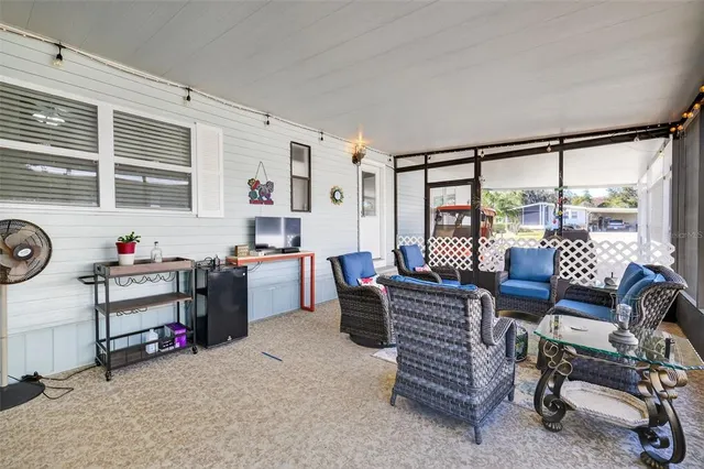 a living room with furniture and a window