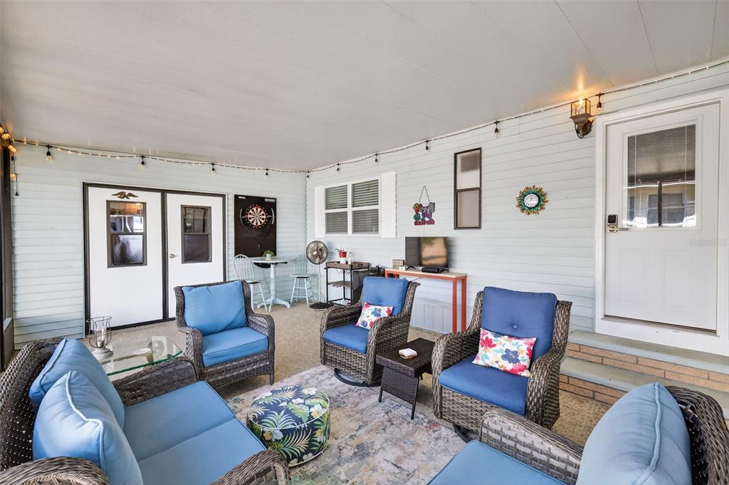 3567 Manatee Road Tavares, FL 32778 - Photo 33 of 45 a living room with furniture rug and window