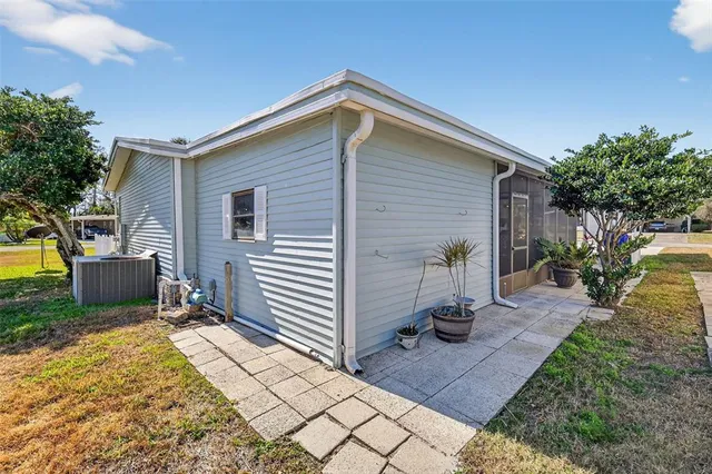 a view of a backyard with sitting area