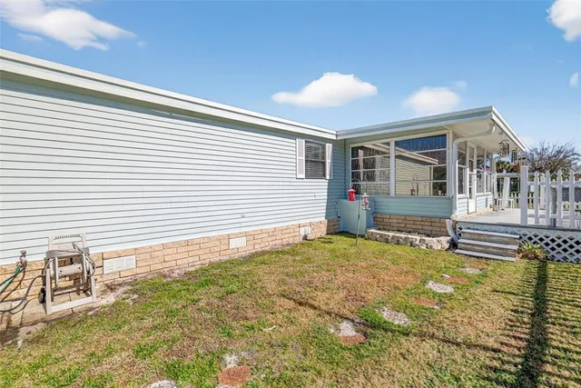a house view with a backyard space