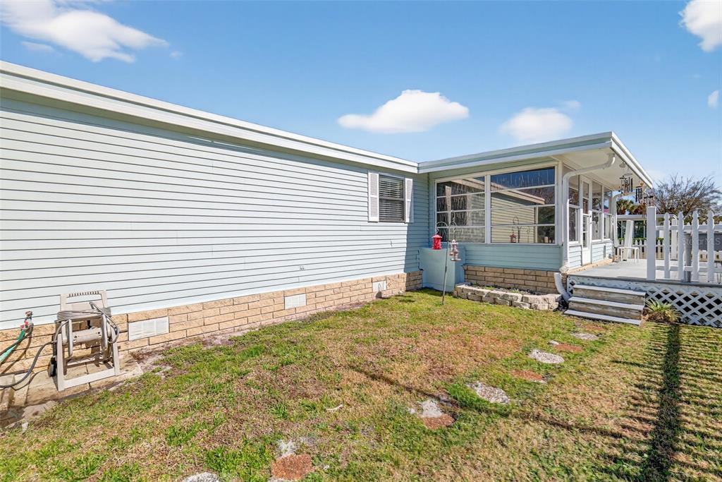 3567 Manatee Road Tavares, FL 32778 - Photo 5 of 45 a house view with a backyard space