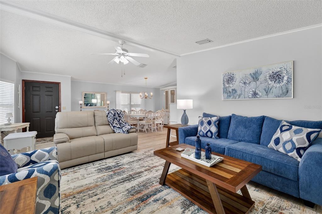 3567 Manatee Road Tavares, FL 32778 - Photo 7 of 67 a living room with furniture ceiling fan and a rug