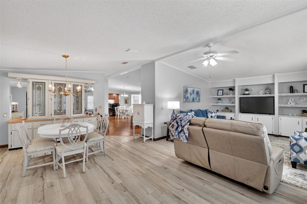 3567 Manatee Road Tavares, FL 32778 - Photo 7 of 45 a living room with furniture and a flat screen tv