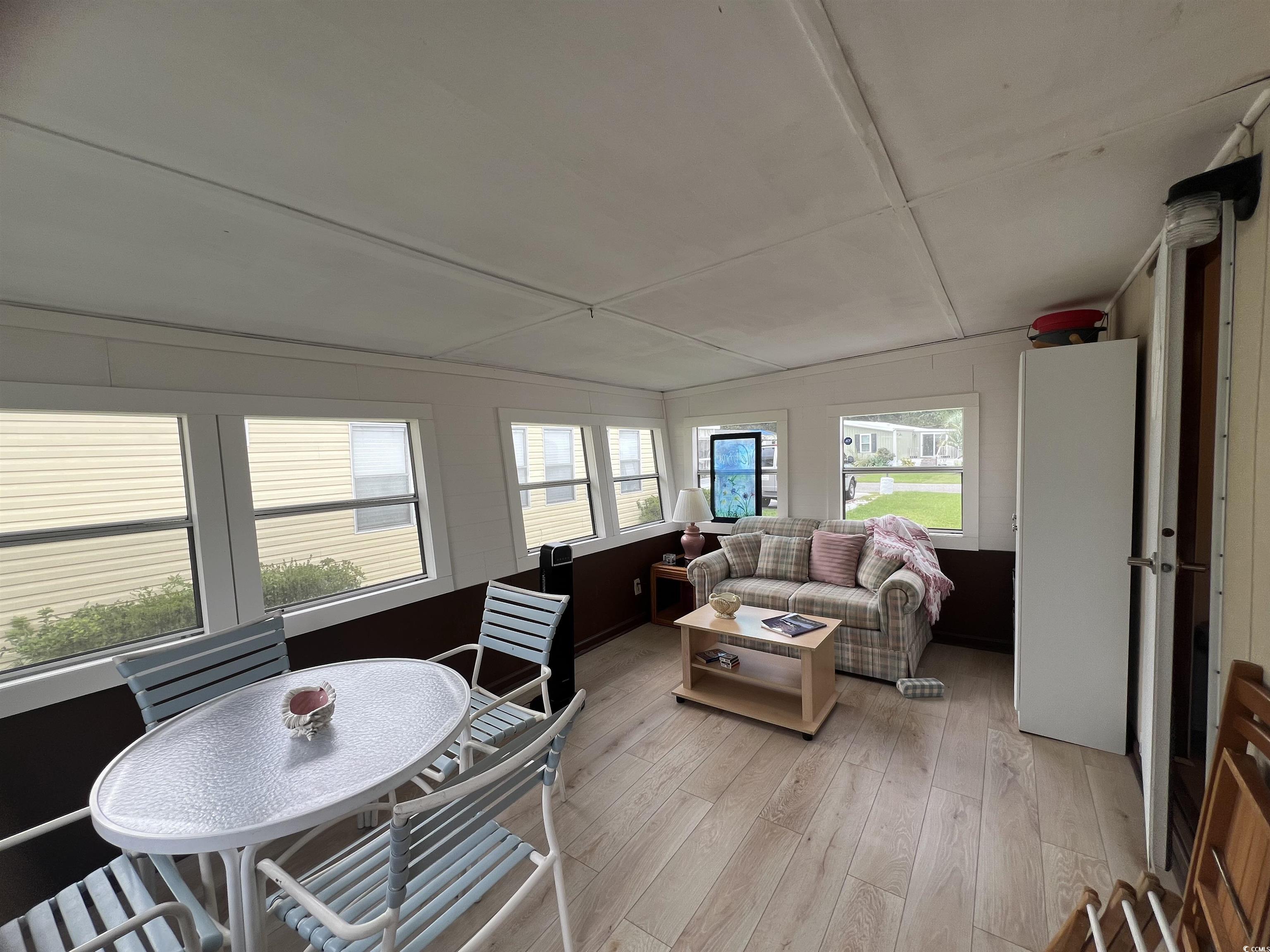 54 Crooked Island Circle Murrells Inlet, SC 29576 - Photo 11 of 37 Sunroom with wood finished floors