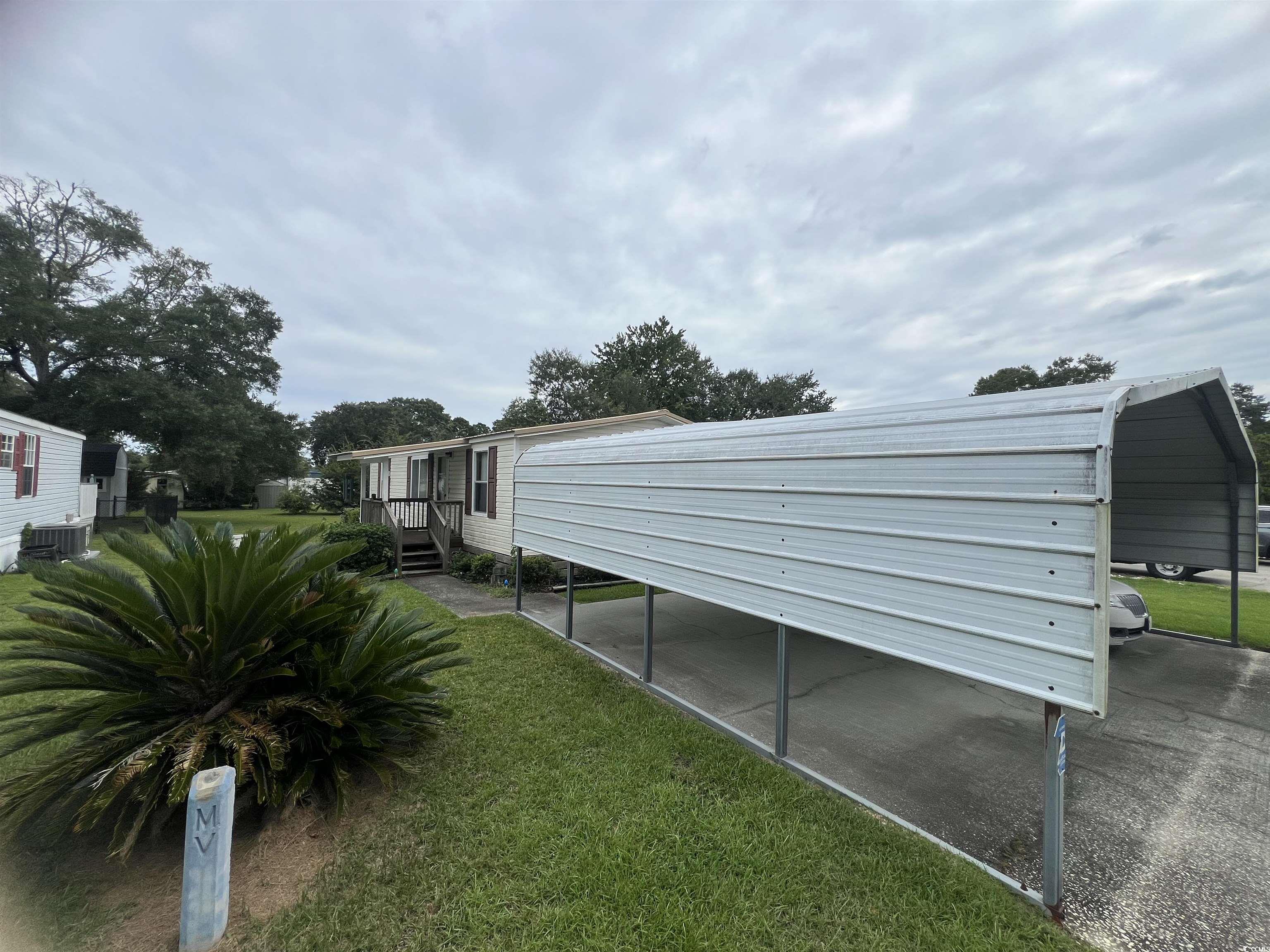 54 Crooked Island Circle Murrells Inlet, SC 29576 - Photo 12 of 37 View of green lawn