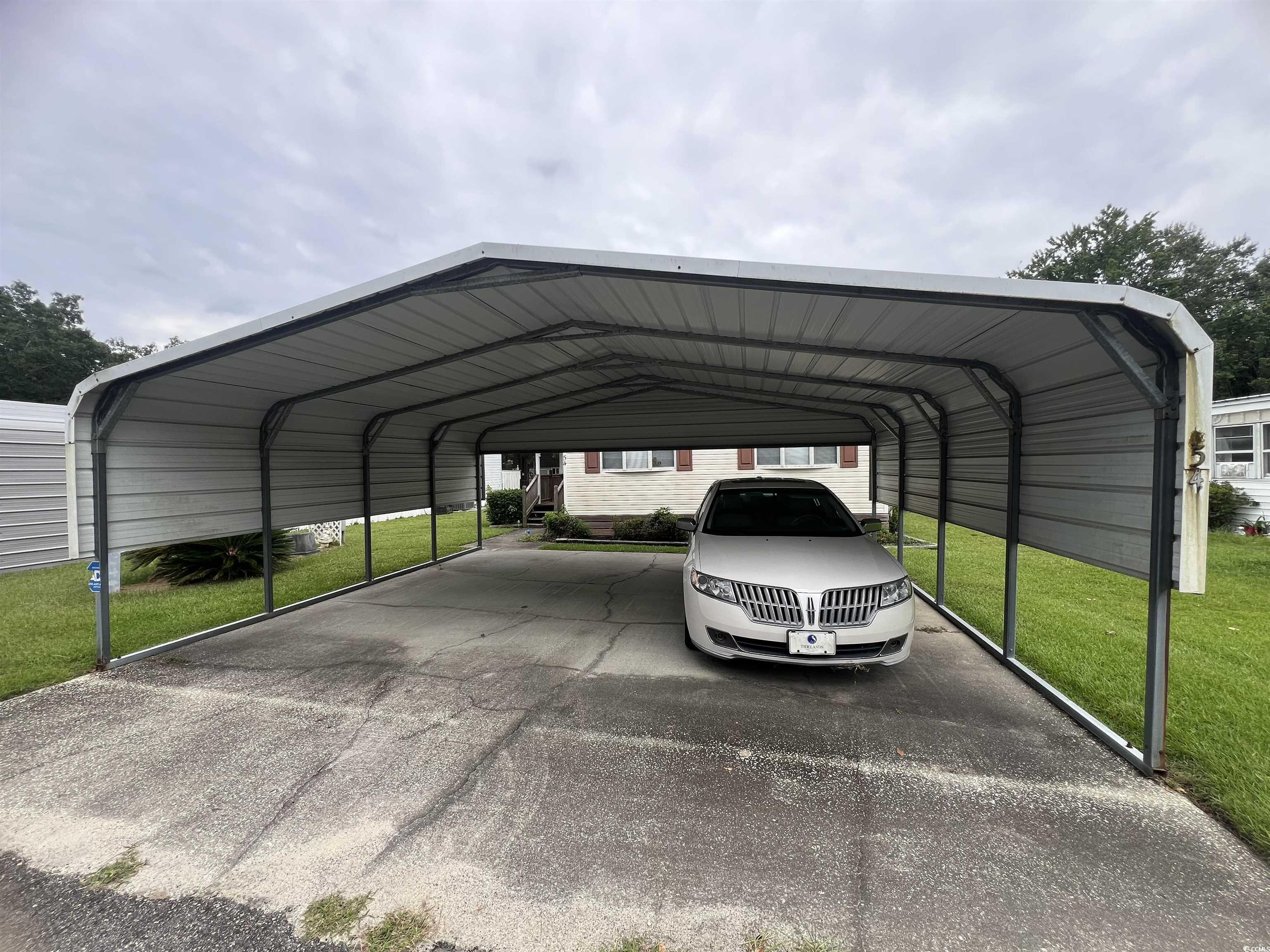 54 Crooked Island Circle Murrells Inlet, SC 29576 - Photo 13 of 37 View of car parking with a carport