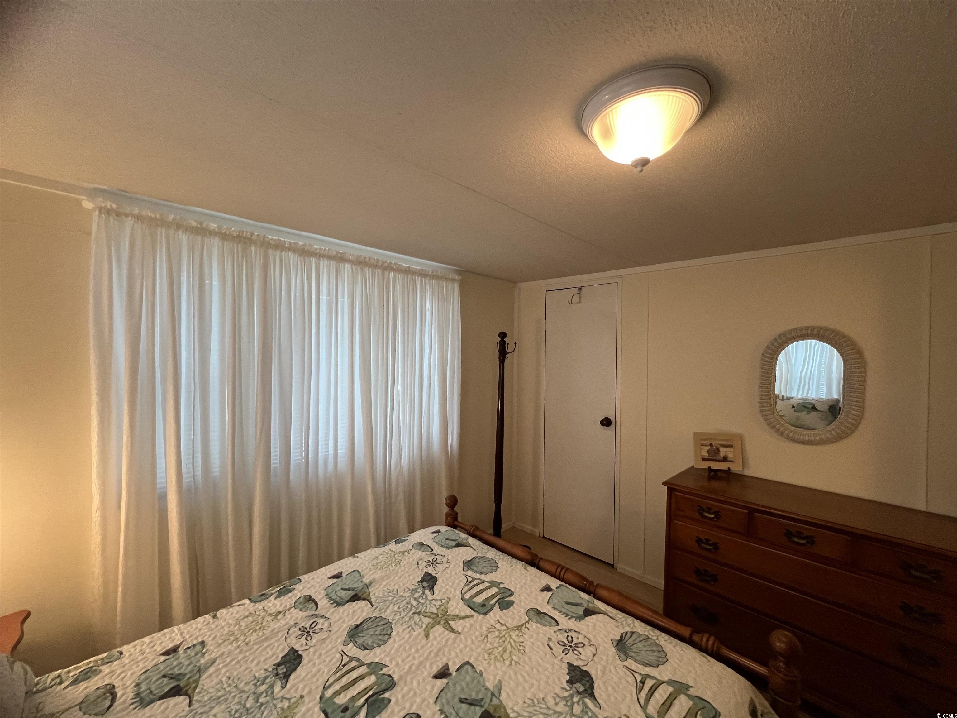 54 Crooked Island Circle Murrells Inlet, SC 29576 - Photo 16 of 37 View of side of home featuring a wooden deck and a lawn
