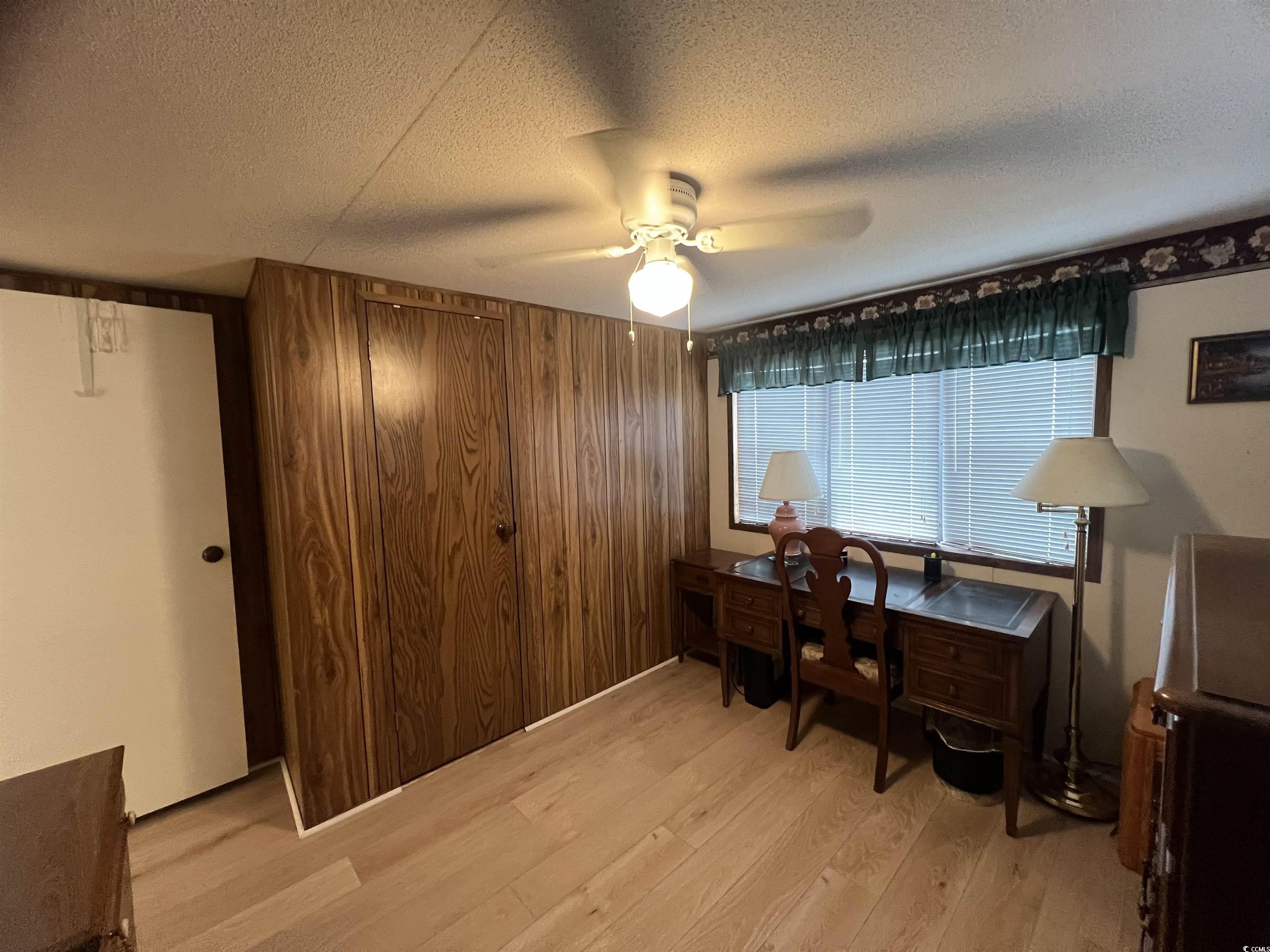 54 Crooked Island Circle Murrells Inlet, SC 29576 - Photo 19 of 37 Full bath featuring a stall shower, a textured ceiling, vanity, and light tile patterned floors