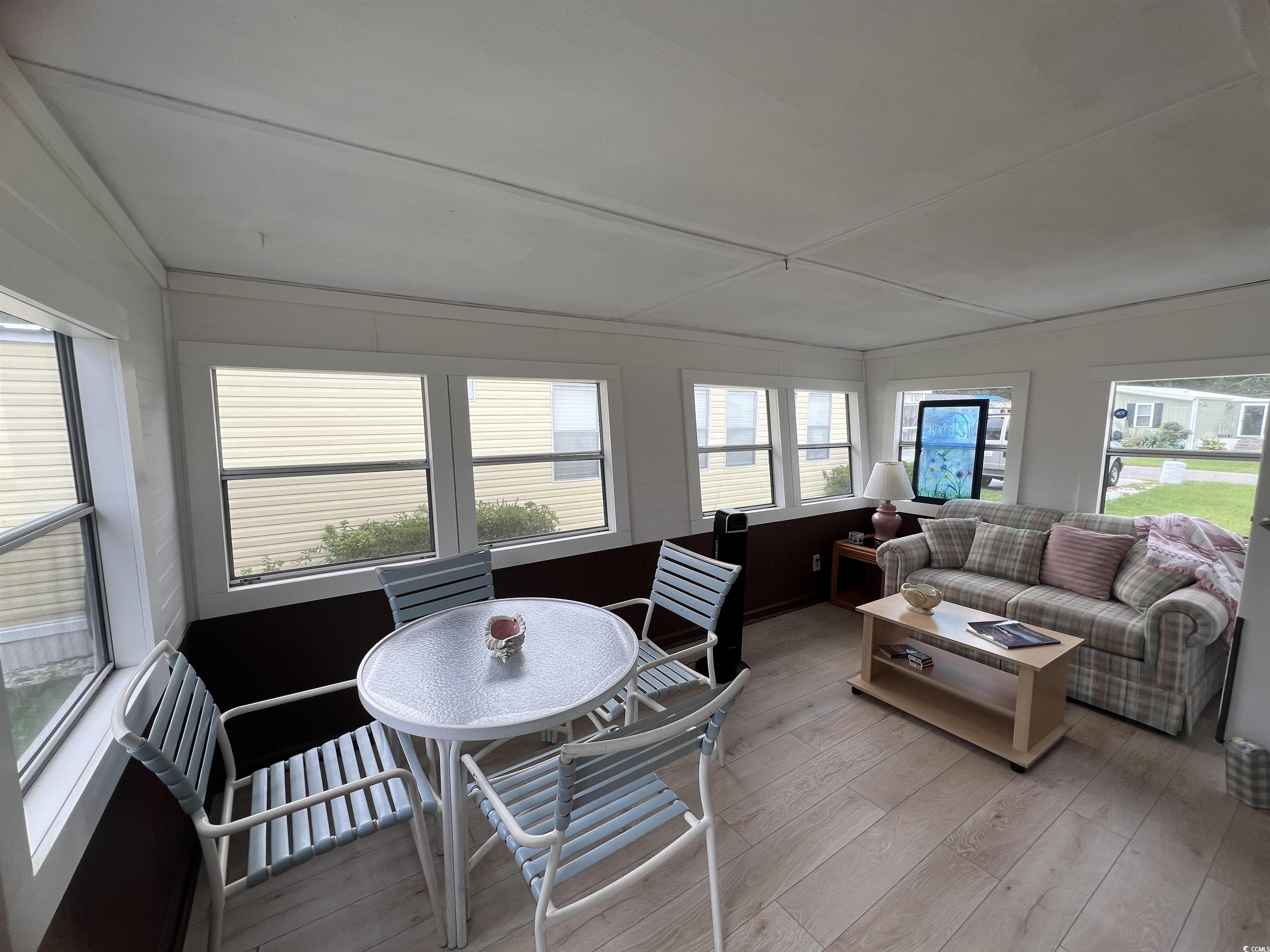 54 Crooked Island Circle Murrells Inlet, SC 29576 - Photo 37 of 37 Kitchen with white appliances, vaulted ceiling, light wood finished floors, ceiling fan, and open floor plan