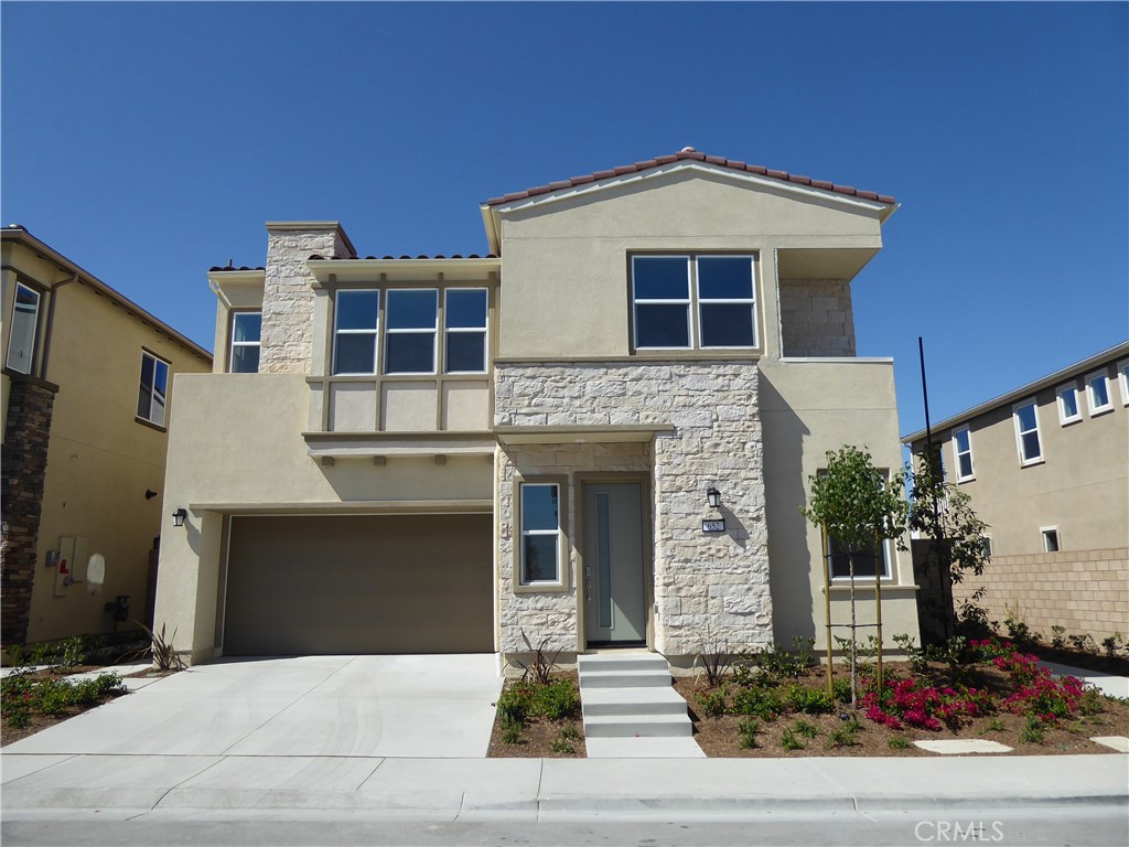 652 Athos Lake Forest, CA 92630 - Photo 1 of 13 a front view of a house with yard