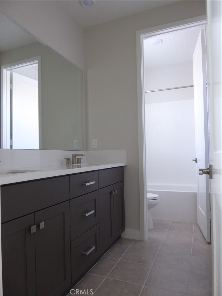 652 Athos Lake Forest, CA 92630 - Photo 12 of 13 a bathroom with a sink and a bathtub