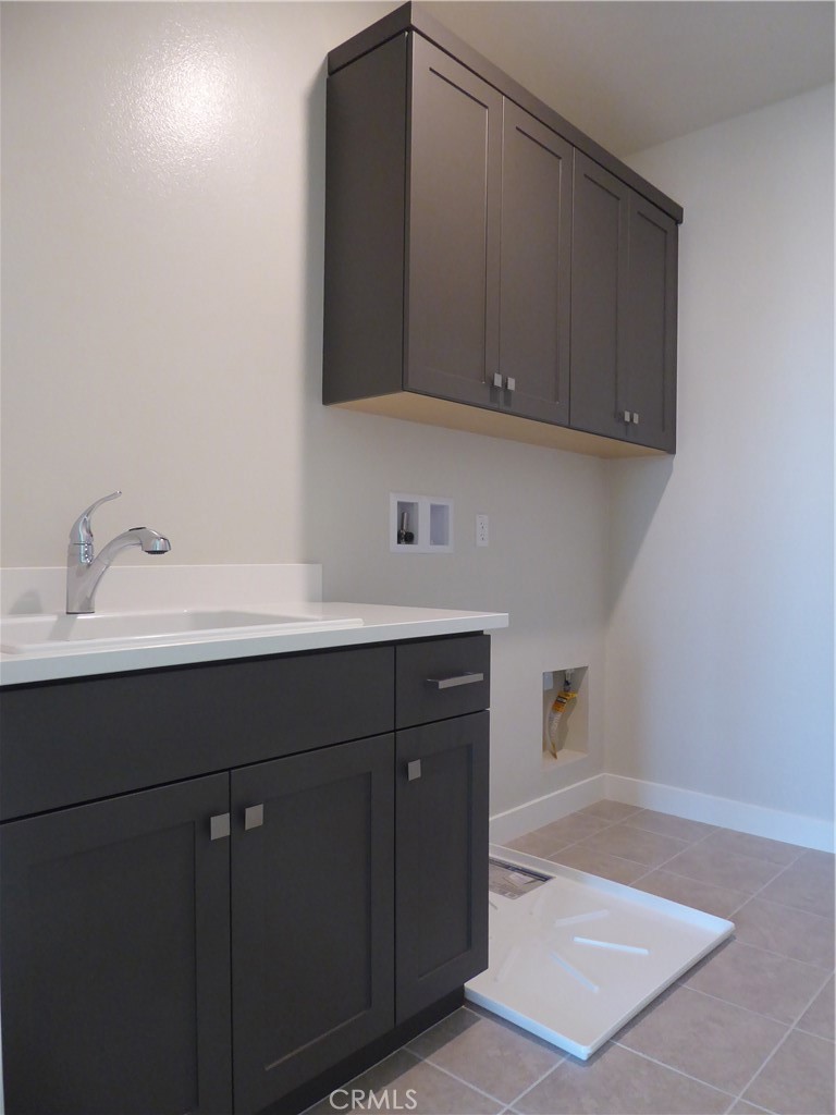 652 Athos Lake Forest, CA 92630 - Photo 13 of 13 a bathroom with a sink and a mirror