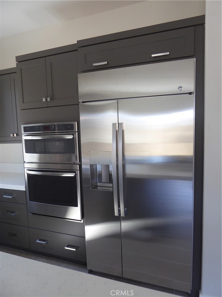 652 Athos Lake Forest, CA 92630 - Photo 3 of 13 a refrigerator in a kitchen