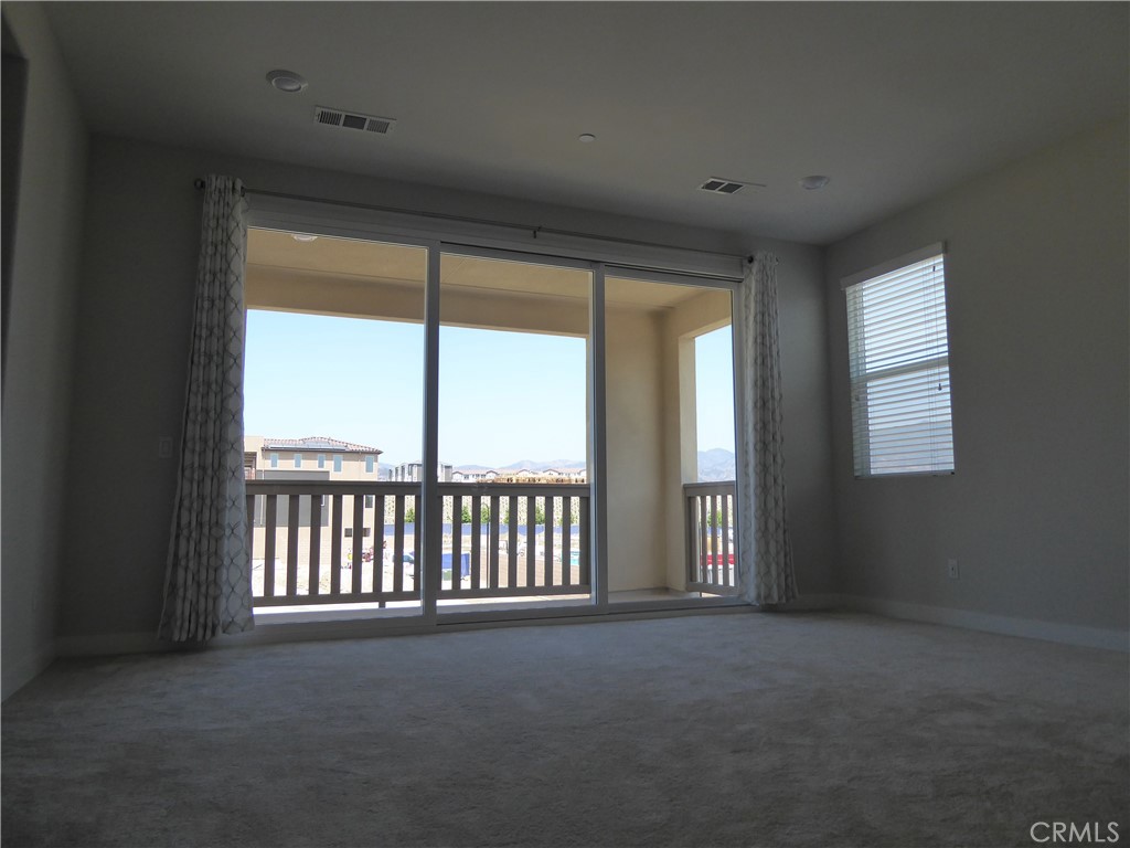 652 Athos Lake Forest, CA 92630 - Photo 6 of 13 a view of a big room with windows