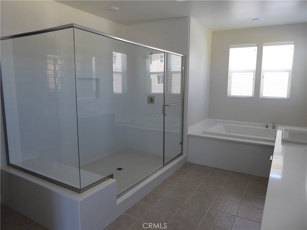 652 Athos Lake Forest, CA 92630 - Photo 8 of 13 a bathroom with a shower and a bathtub