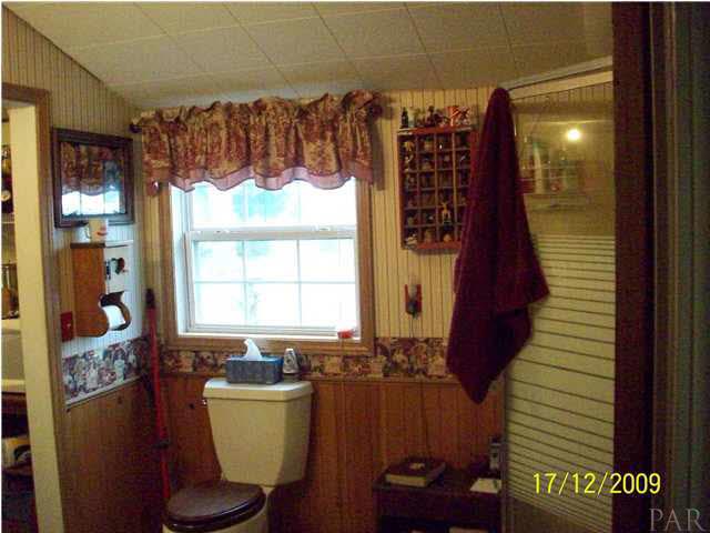 3950 Gobbler Road Century, FL 32535 - Photo 15 of 24 This is the guest bathroom/laundry room