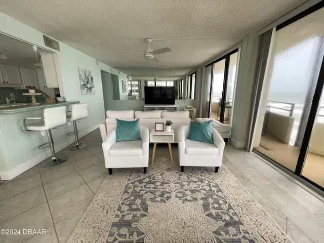 a kitchen with granite countertop a sink a counter top space and stainless steel appliances