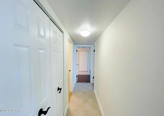 a bedroom with a bed and a tv