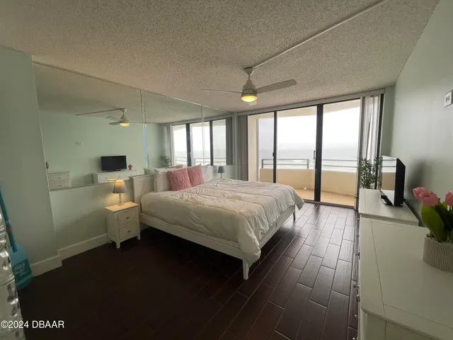 a bathroom with a shower and a sink