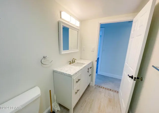 a very nice looking room with many windows and furniture