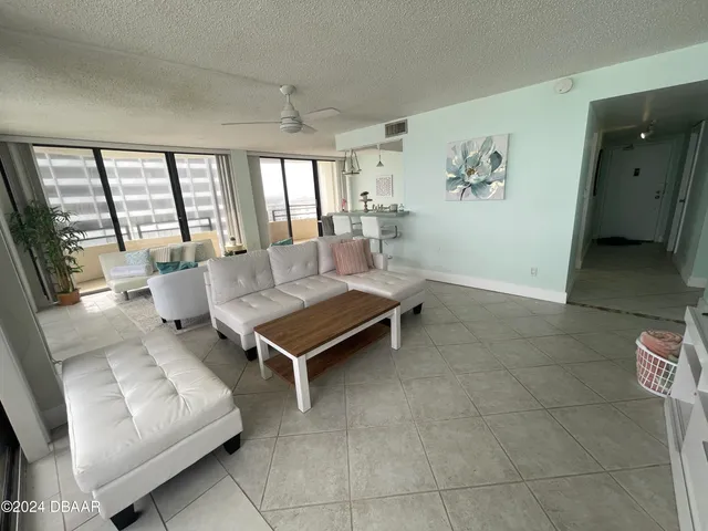 a living room with lots of furniture and a rug