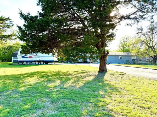 a house view with a sitting space and garden