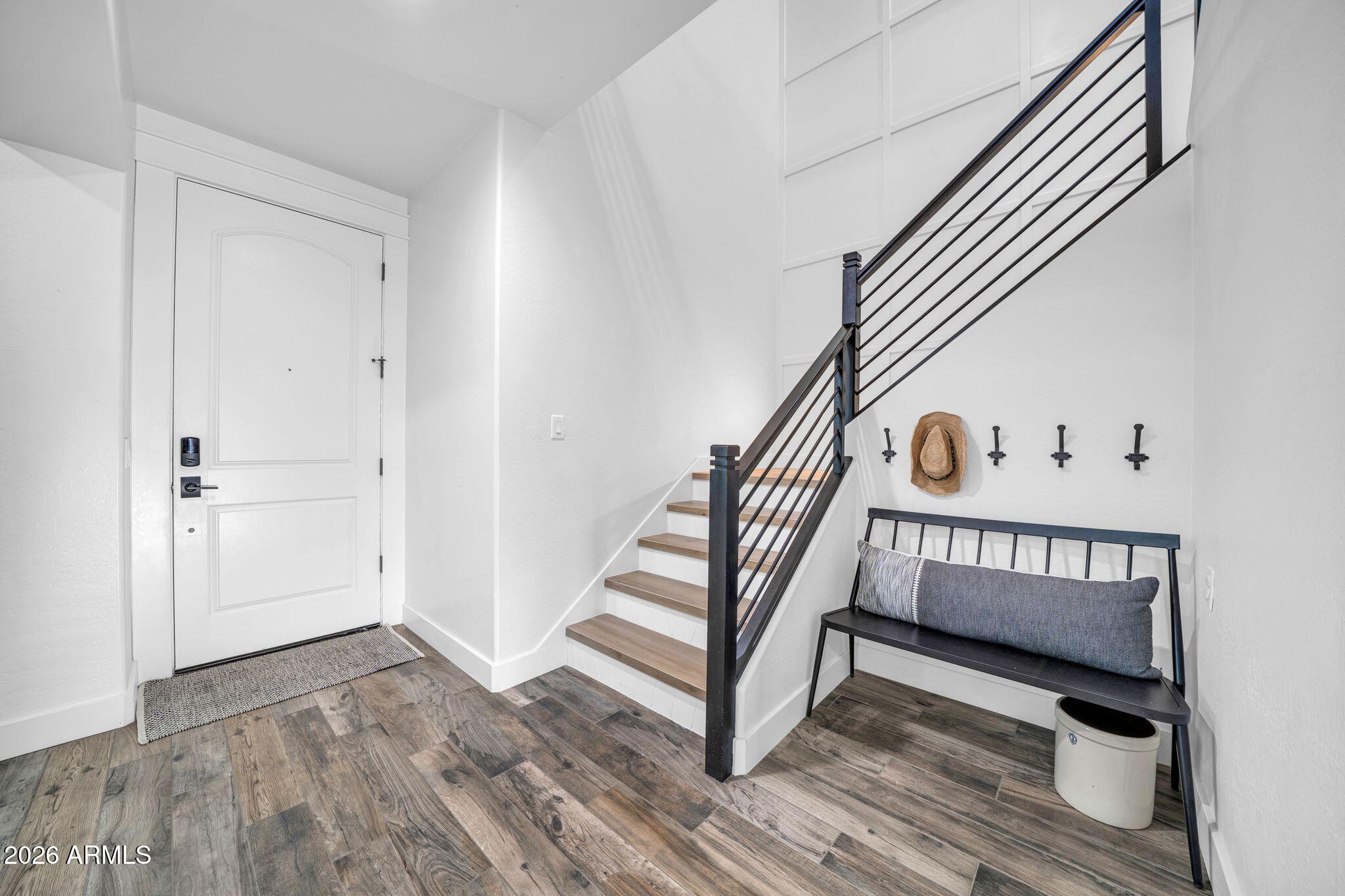 2985 North Point Ridge Road Buckeye, AZ 85396 - Photo 38 of 107 a view of a hallway with entryway and wooden floor