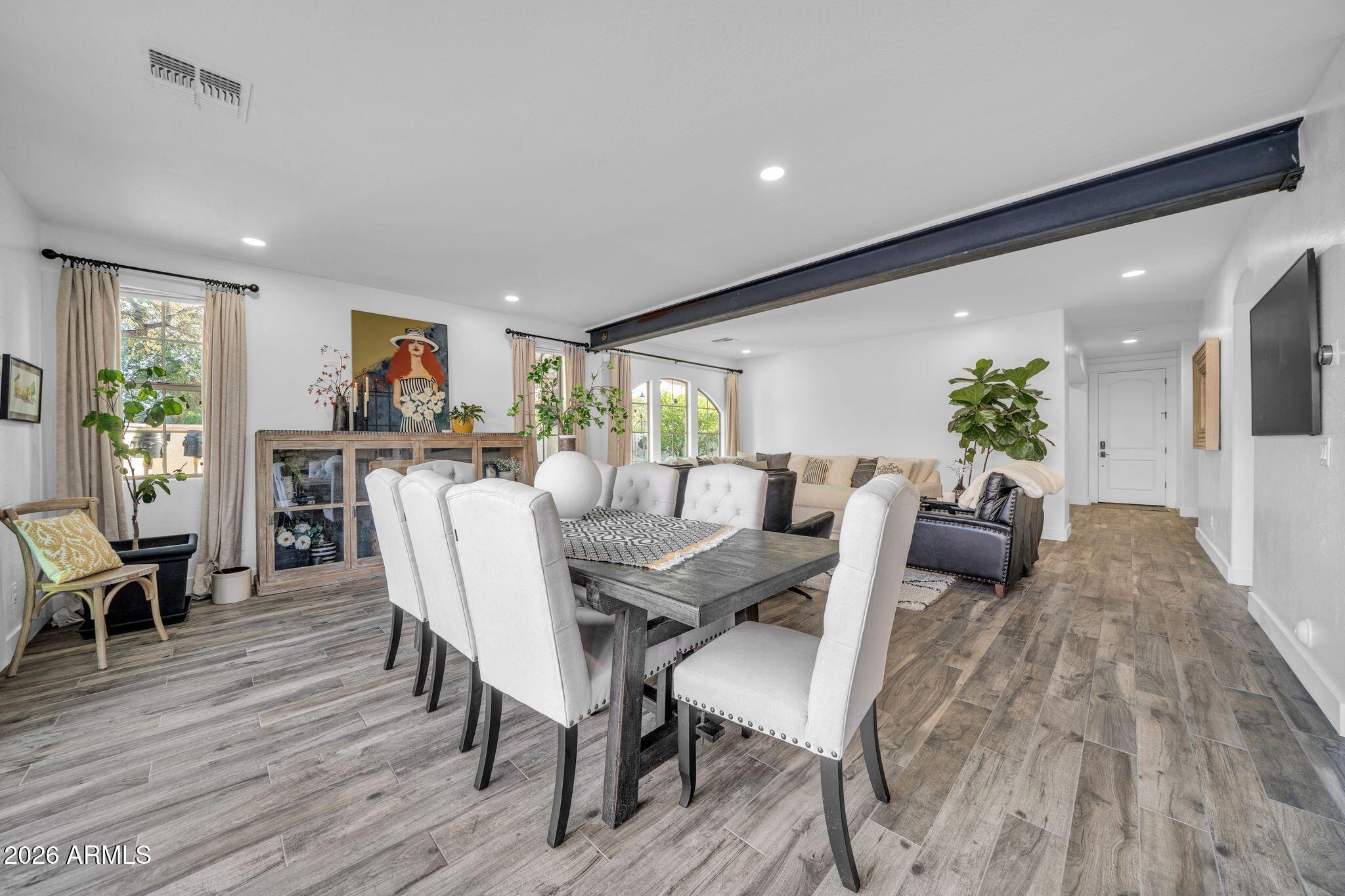 2985 North Point Ridge Road Buckeye, AZ 85396 - Photo 42 of 107 a view of a dining room with furniture window and wooden floor