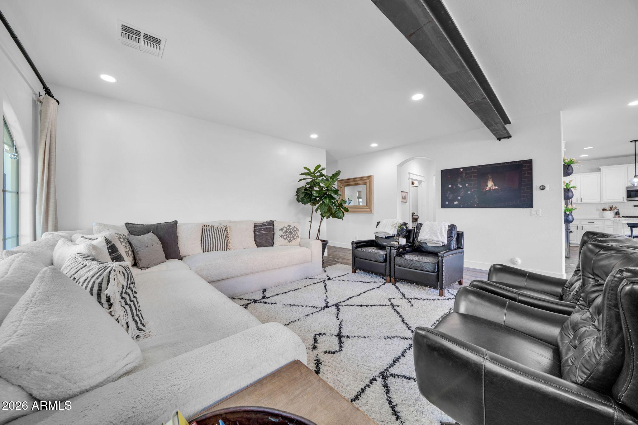2985 North Point Ridge Road Buckeye, AZ 85396 - Photo 43 of 107 a living room with furniture and a flat screen tv