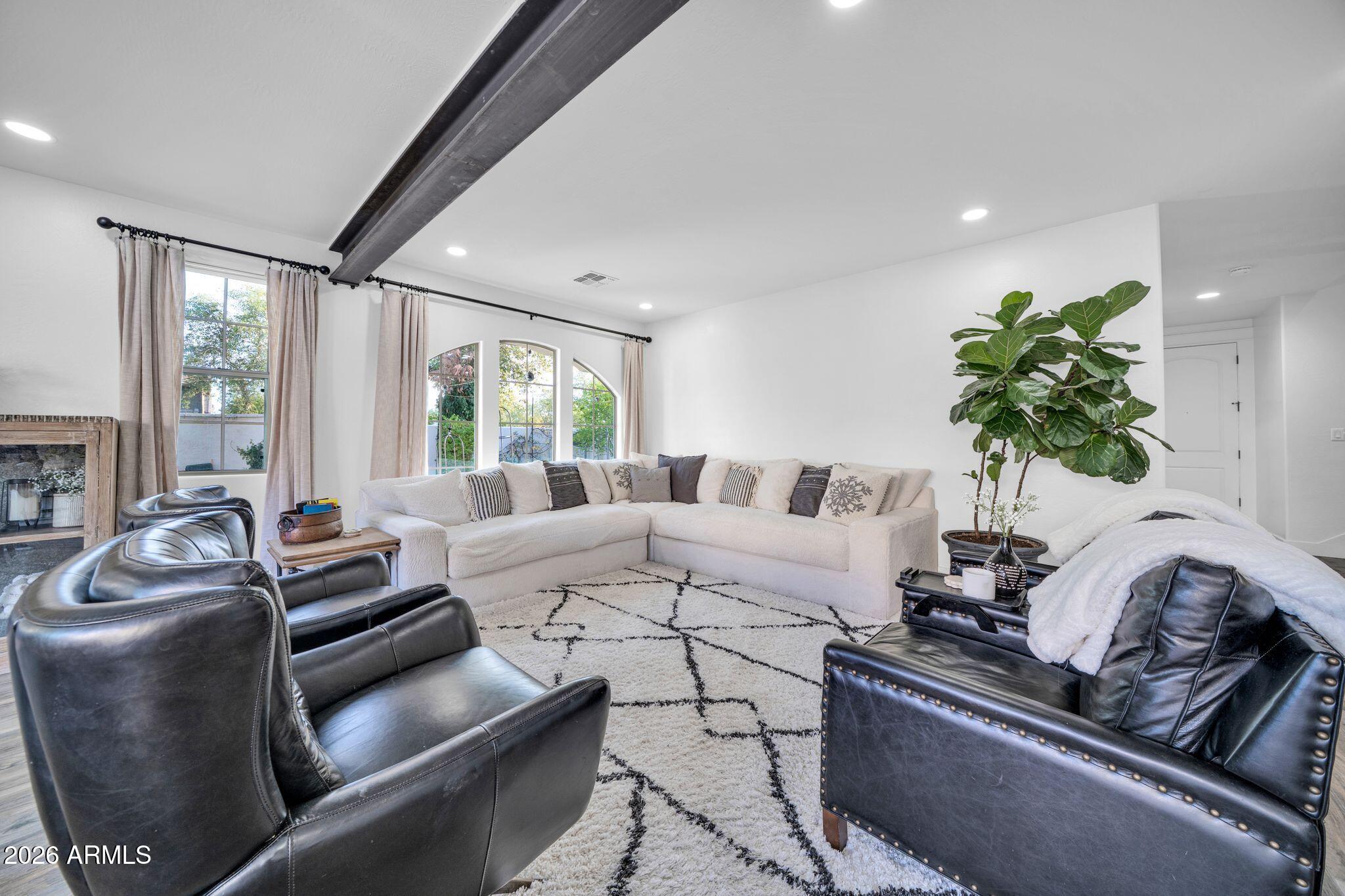 2985 North Point Ridge Road Buckeye, AZ 85396 - Photo 44 of 107 a living room with furniture flowerpot and a large window