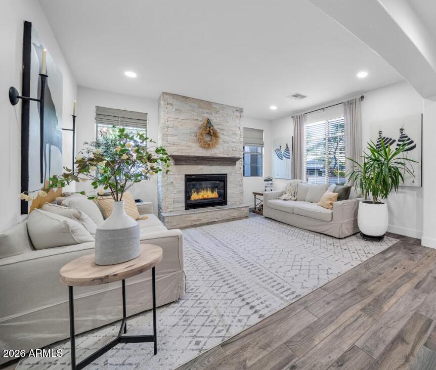 2985 North Point Ridge Road Buckeye, AZ 85396 - Photo 47 of 107 a living room with furniture a fireplace and a potted plant