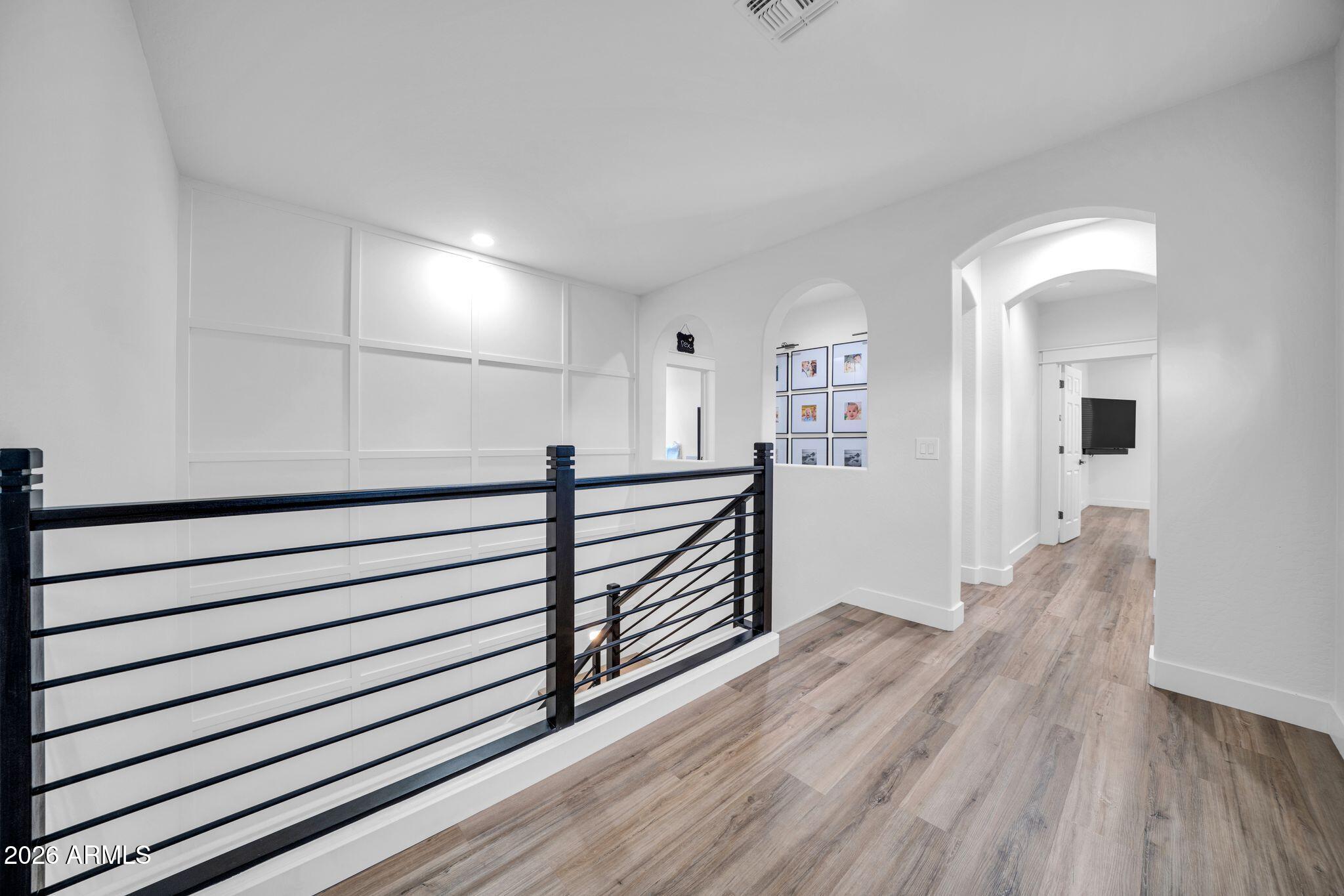 2985 North Point Ridge Road Buckeye, AZ 85396 - Photo 67 of 107 a view of a hallway with wooden floor