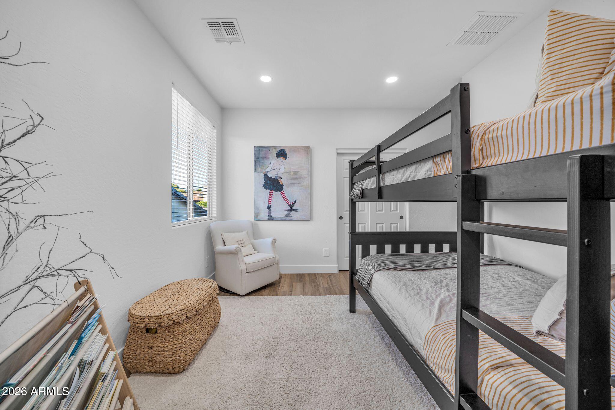 2985 North Point Ridge Road Buckeye, AZ 85396 - Photo 69 of 107 a bedroom with furniture and window