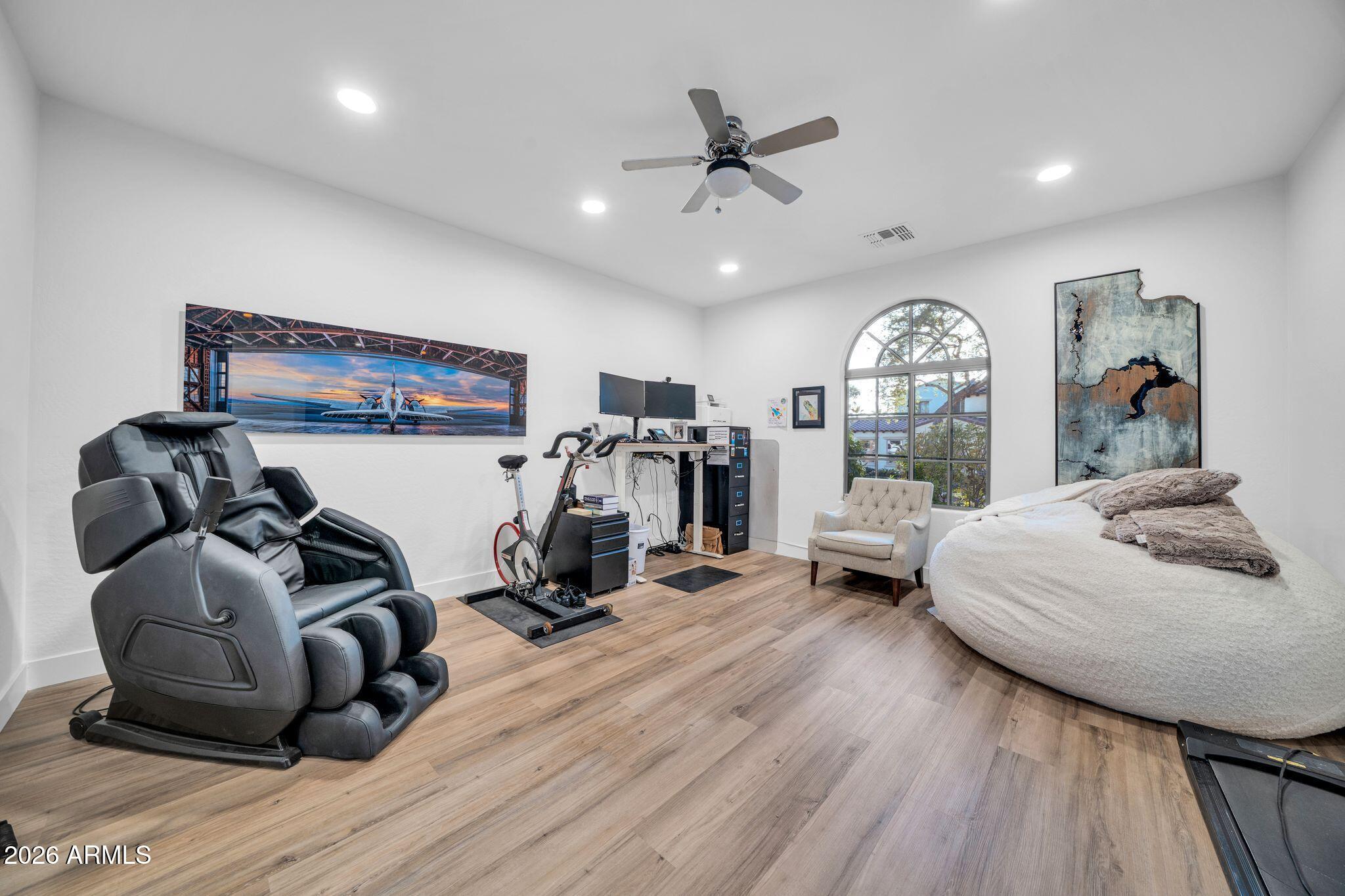 2985 North Point Ridge Road Buckeye, AZ 85396 - Photo 76 of 107 a view of a room with gym equipment