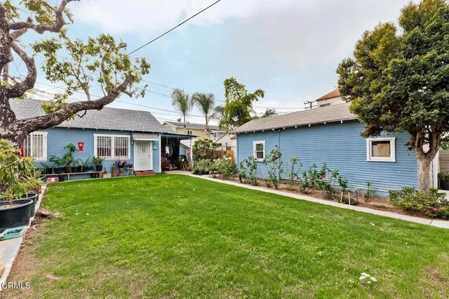 a view of a house with a yard porch and sitting area
